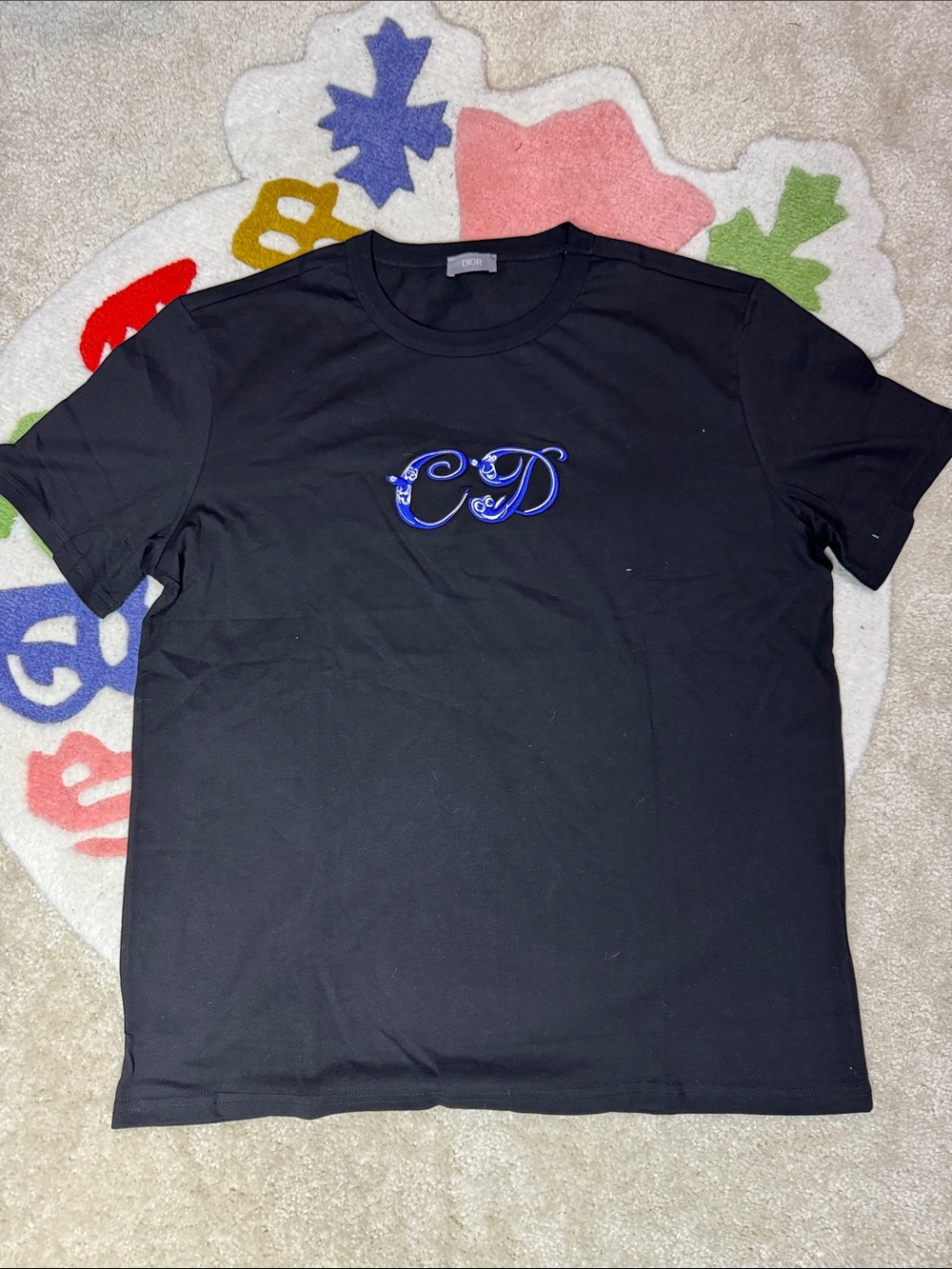 Black Short-Sleeve Tee with Blue Script Emblem